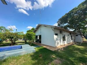 a house with a solar panel in the yard at Villa'S Roraima - Pousada & Natureza in Boa Vista