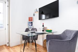 a dining room with a glass table and two chairs at Boutique Apartment in the Heart of Lisbon ! Lemonn B in Lisbon