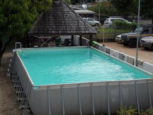 a large pool of water in a parking lot at At Rachel in Paramaribo