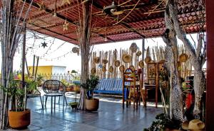 a room filled with lots of plants and chairs at Posada del Fraile in Tepotzotlán