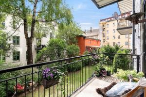 a balcony with a view of a city at Alexander Kiellands plass - City Center Oslo in Oslo