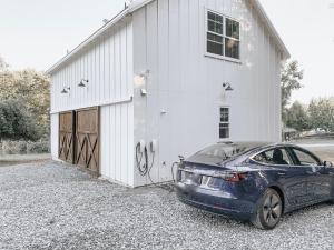 a car parked in front of a garage at Homestead Barn Loft in Sonora