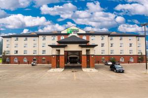 a hotel with a parking lot in front of it at Holiday Inn Express Hotel & Suites - Slave Lake, an IHG Hotel in Slave Lake