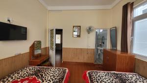 TV a/nebo společenská místnost v ubytování Đông Đức Hostel Đà Lạt + 23 fotografií