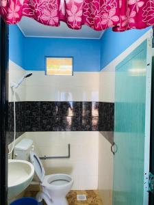 a bathroom with a toilet and a sink at Ella's Place Salang Tioman in Tioman Island