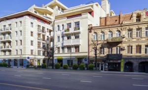 a row of buildings on a city street at Hotel type rooms on avenue Melikishvili, city center in Tbilisi City