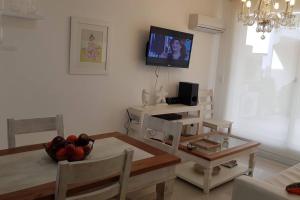 TV a/nebo společenská místnost v ubytování Diseño 03 - Ayres del Puerto Apto 1 dormitorio