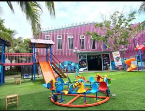 a park with a playground with a slide at Maldives B3-30 Oceanami Villas & Beach Club in Long Hai