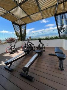 two exercise bikes sitting on a wooden deck at Rincon Moderno cerca aeropuerto in Guatemala