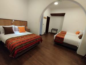 Letto o letti in una camera di Casona Tobar Hotel