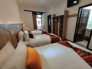 Letto o letti in una camera di Casona Tobar Hotel