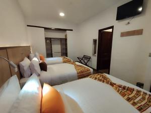 Letto o letti in una camera di Casona Tobar Hotel