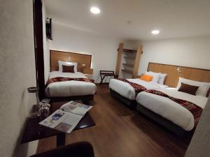 Letto o letti in una camera di Casona Tobar Hotel