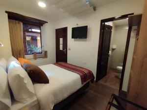 Letto o letti in una camera di Casona Tobar Hotel