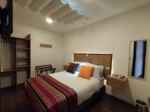 Letto o letti in una camera di Casona Tobar Hotel