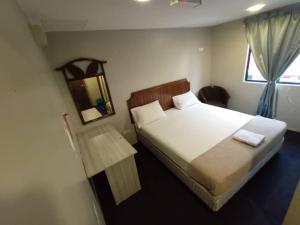 Postel nebo postele na pokoji v ubytování HOTEL Rampai Rooms
