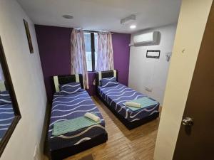 Postel nebo postele na pokoji v ubytování HOTEL Rampai Rooms