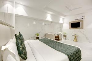 a hotel room with a bed and a tv at Hotel International Inn by Star group - Near Delhi Airport in New Delhi