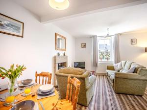 a living room with a table and chairs and a couch at 2 bed in Berwick Upon Tweed 81273 in Berwick-Upon-Tweed