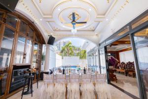 a restaurant with a row of chairs in a building at B2.20 Hoàng Sơn in Vung Tau