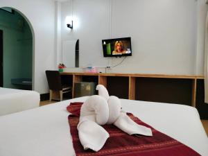 Postel nebo postele na pokoji v ubytování S2S Queen Trang Hotel