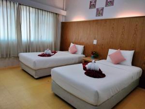 Postel nebo postele na pokoji v ubytování S2S Queen Trang Hotel