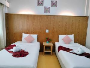 Postel nebo postele na pokoji v ubytování S2S Queen Trang Hotel