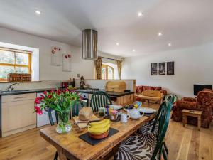a kitchen and living room with a wooden table at 3 Bed in Huntly 57368 in Insch