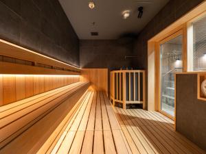 a bowling alley with wooden floors and a window at Super Hotel Osaka Natural Hot Springs in Osaka