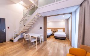 Postel nebo postele na pokoji v ubytování New Seoul Hotel Myeongdong + 108 fotografií