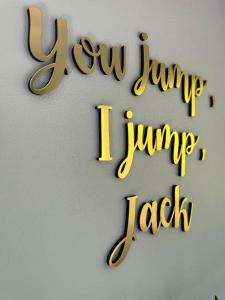 a sign that reads july jump jump july tack at ลอดจ์พังงา บูทีค in Phangnga