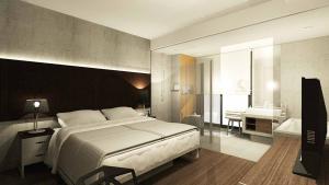 Letto o letti in una camera di The B Hotel Quezon City