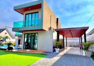 a house with a view of the ocean at Por House99 poolvilla in Hua Hin