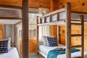 a bedroom with two bunk beds in a cabin at Yesteryear in Sevierville