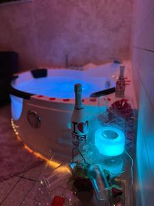 a bath tub with a bottle of beer and lights at LE DIMORE CENTRO in Gallipoli