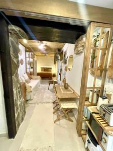 a living room with a stone wall at Arcos de Tarifa, Casco historico in Tarifa