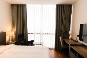 Postel nebo postele na pokoji v ubytování Sky View Hotel