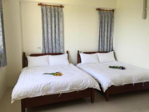 Letto o letti in una camera di Village Tree B&B