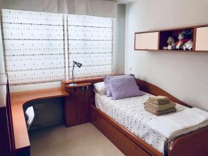 a bedroom with a desk with a bed and a desk at Castillo de Miramar in Fuengirola +16 photos
