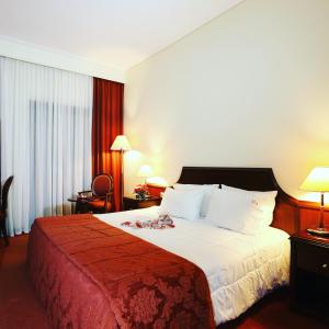 Uma cama ou camas num quarto em Hotel Apollonia Delphi