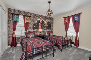 a bedroom with two beds and a brick wall at Top Villas - Storey Lake Resort 482 in Kissimmee