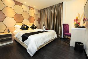 Postel nebo postele na pokoji v ubytování Mercury Boutique Hotel