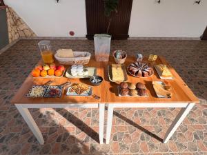 a wooden table with food on top of it at Agriturismo Graziano e Barbara in Porto Conte