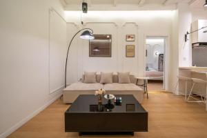 a living room with a couch and a table at Shanghai Downtown Yidu B&B - Near People's Square Metro Station in Shanghai