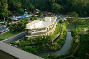 an aerial view of a building next to a river at Ferringhi Luxury Suite @ By The Sea in Batu Ferringhi