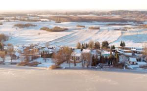 an aerial view of a village in the snow at Kaktus in Pasym