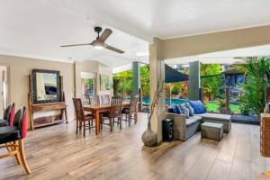 a living room with a couch and a table at Serenity @ Bayview in Bayview Heights