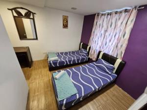 Postel nebo postele na pokoji v ubytování HOTEL Rampai Rooms