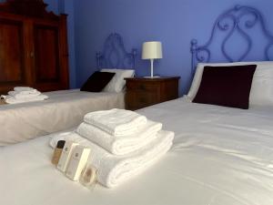 En eller flere senge i et værelse på Casa Lodovica