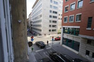 a view of a city street with cars and buildings at Budapest Pest-port apartment 4 rooms for 16 person in Budapest